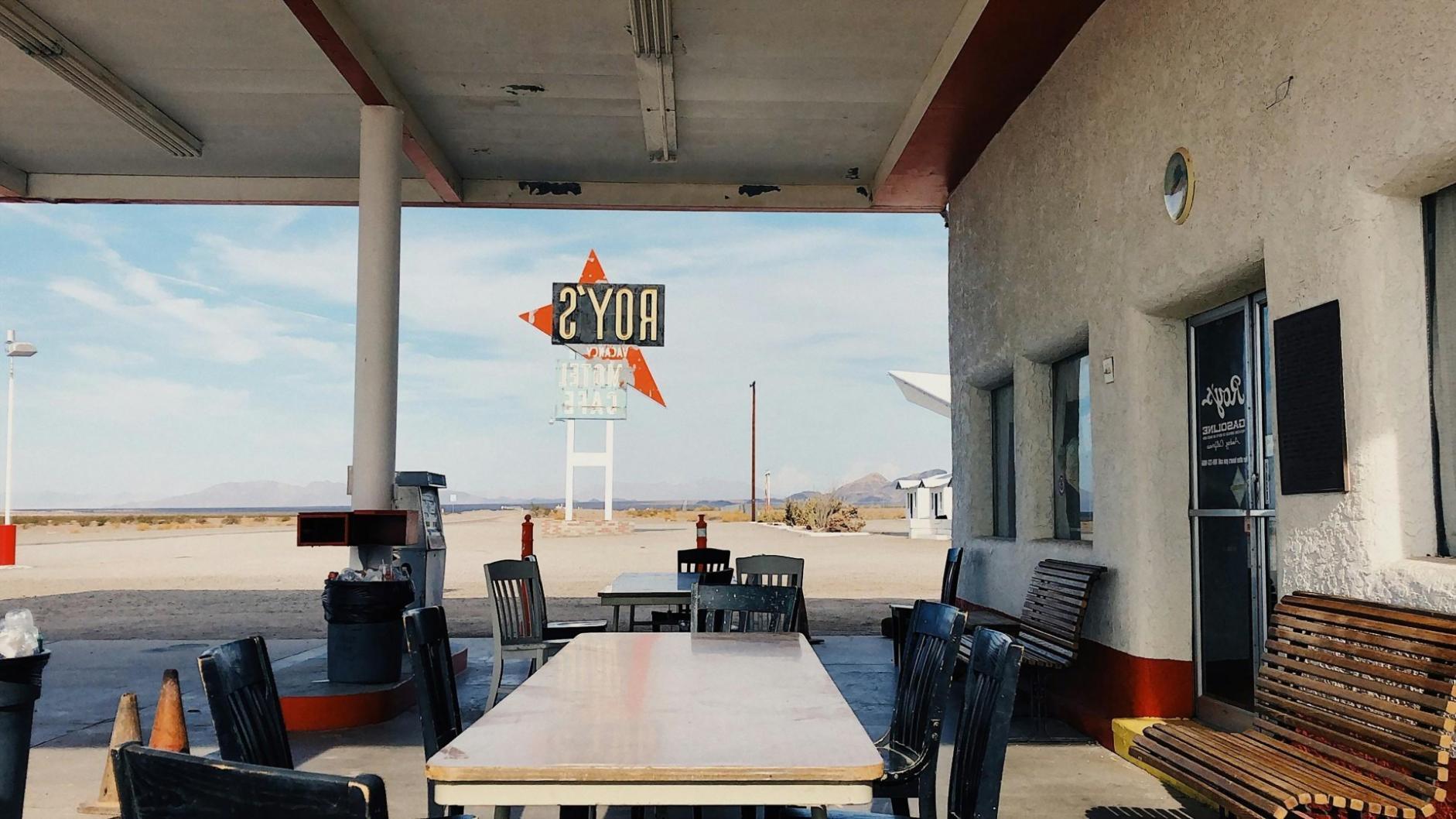 Team collaboration meeting with financial planning materials and laptops on conference table
